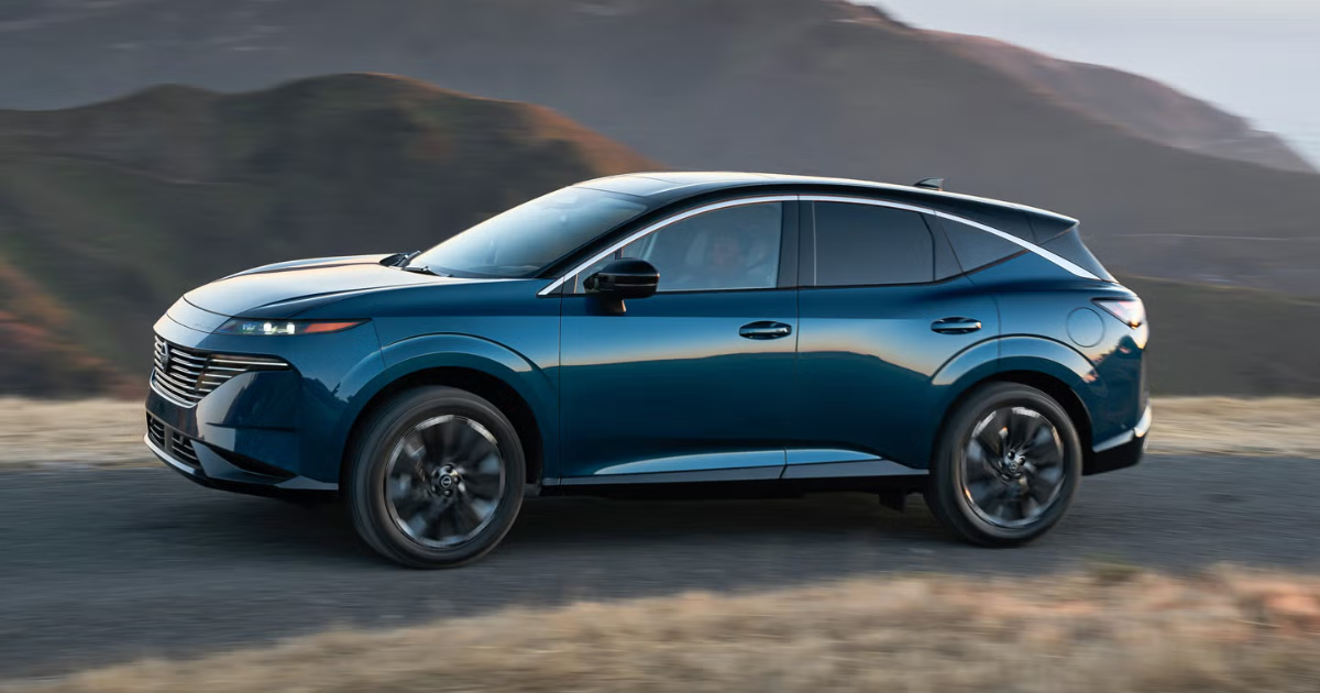 2025 Nissan Murano driving on a narrow road with a mountains in the background